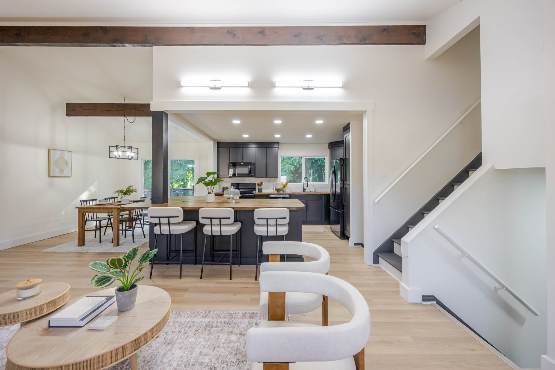 Bright open-plan living room and kitchen with balanced interior and window light